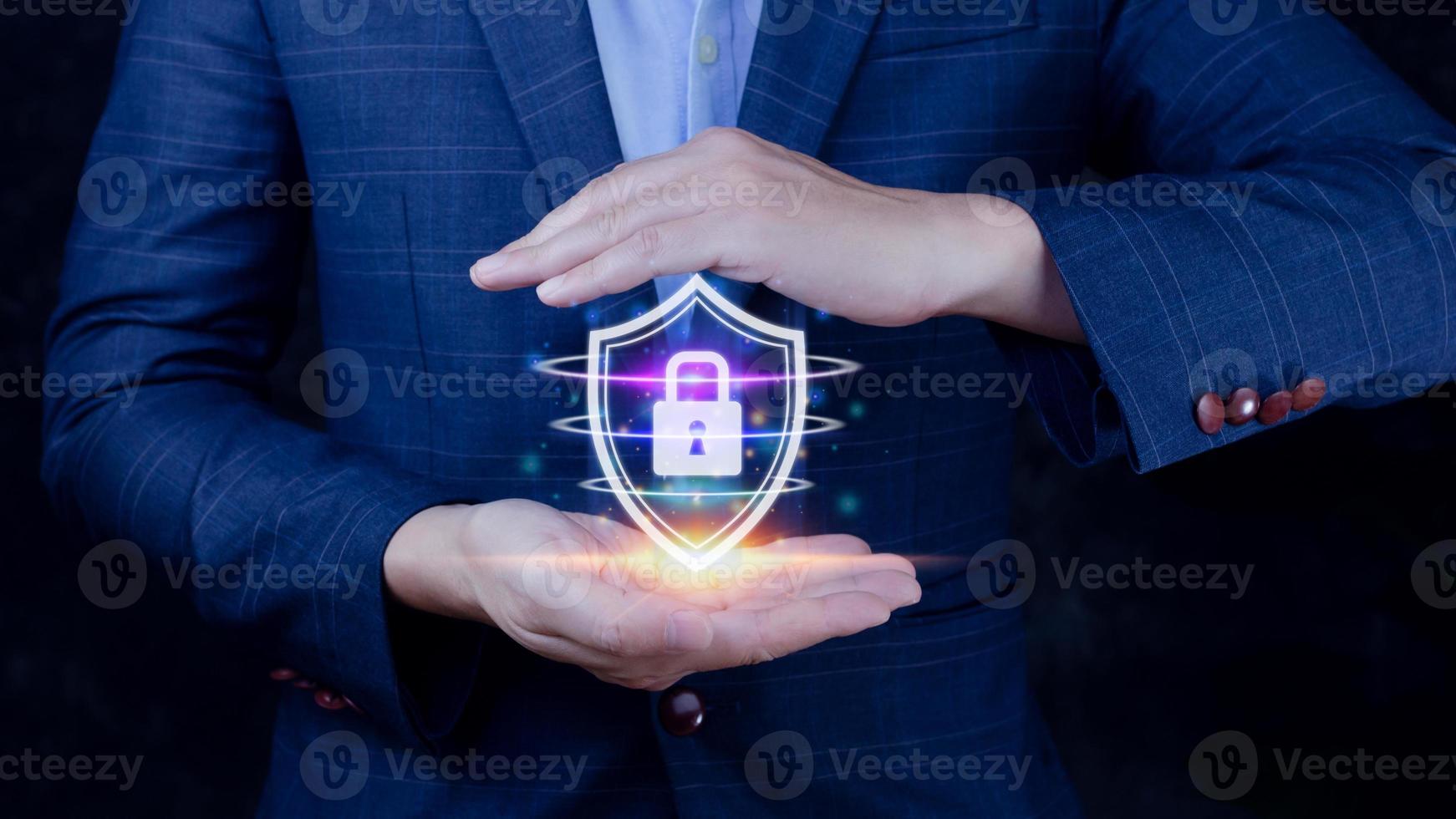 Computer network protection, secure and safe your data concept, businessman holding shield protection icon, Security shield Lock Security Businessman Protect Concept photo