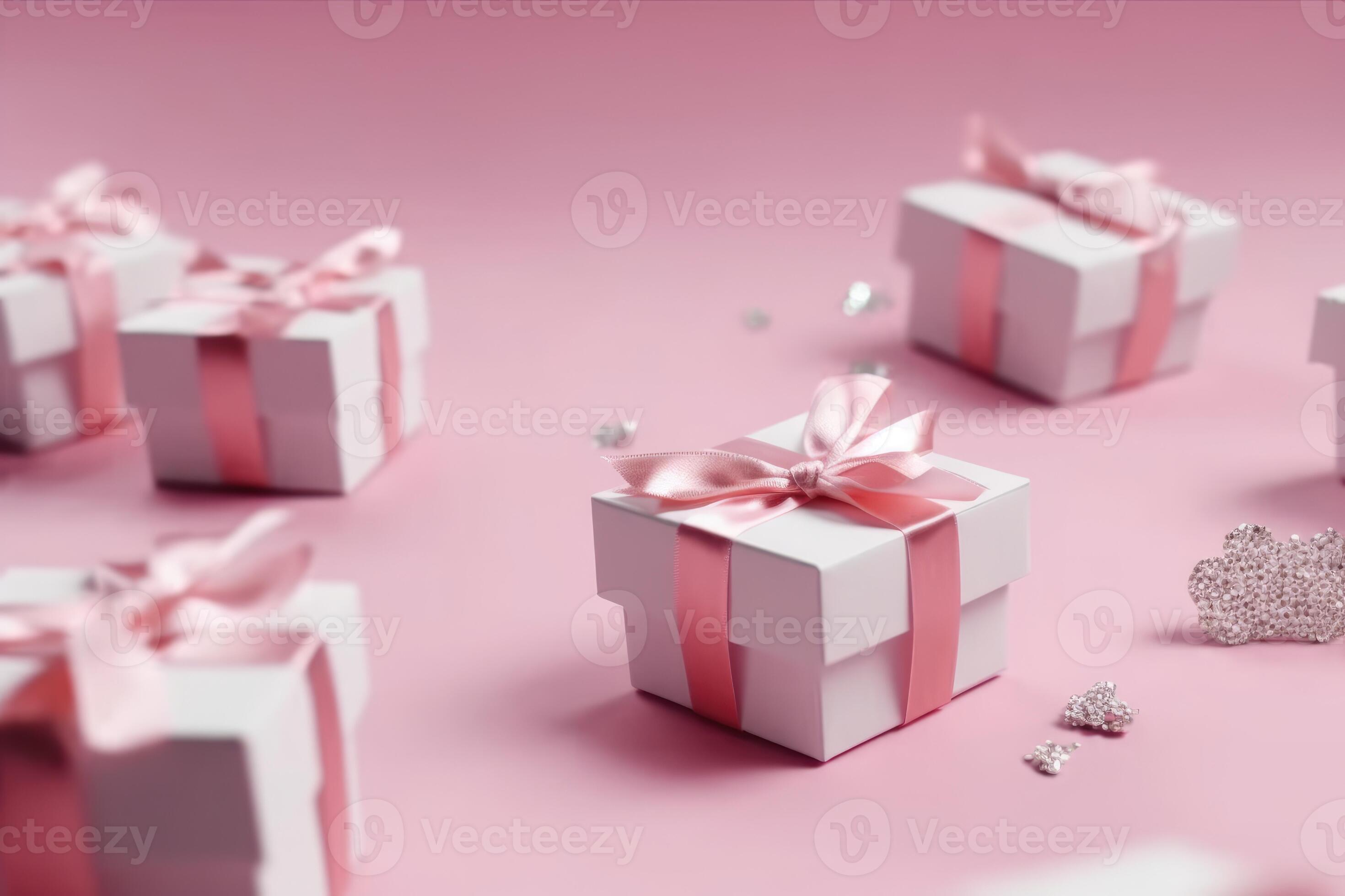 Top view photo of pink gift boxes with pink bow on isolated pastel pink