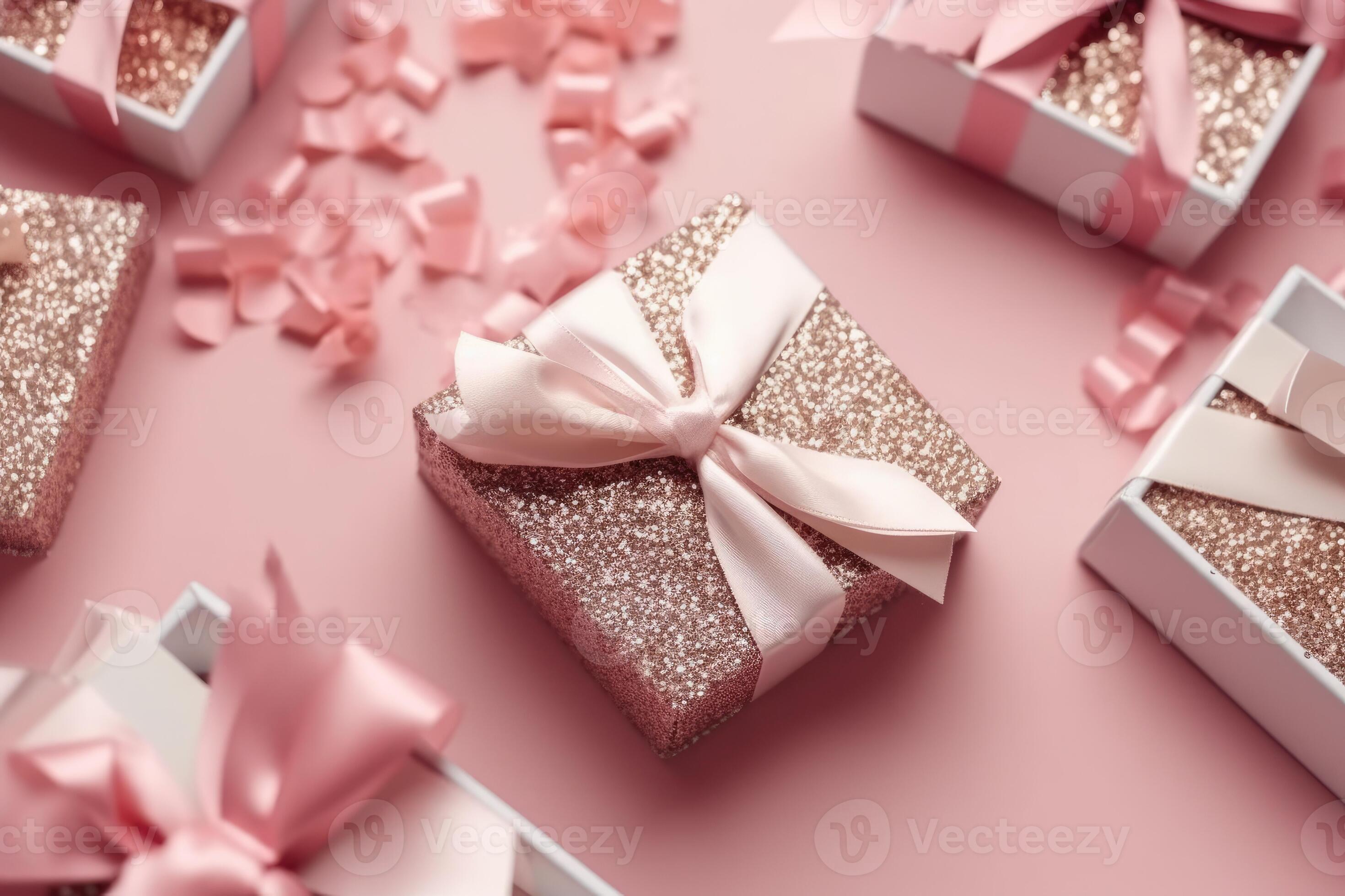 Top view photo of pink gift boxes with pink bow on isolated pastel pink ...