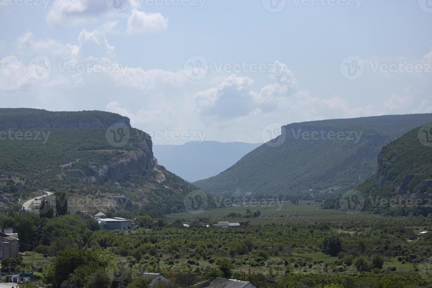 A mountain canyon covered by forest against the sky. Landscape. Belbek River photo