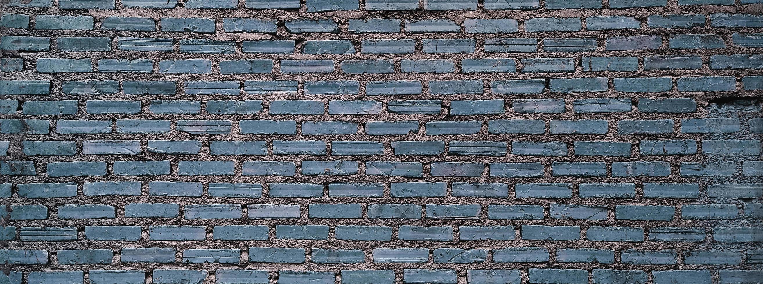 Vintage brick wall with horizontal structure. Panoramic web banner or wallpaper with copy space. photo