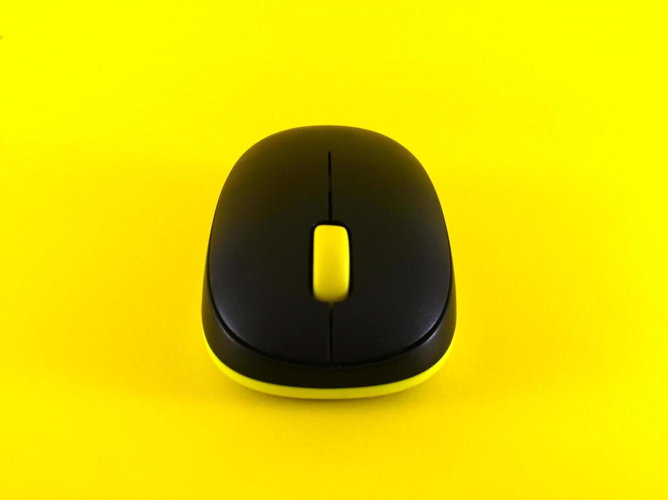 White wireless mouse on yellow background, minimal, flatlay photo