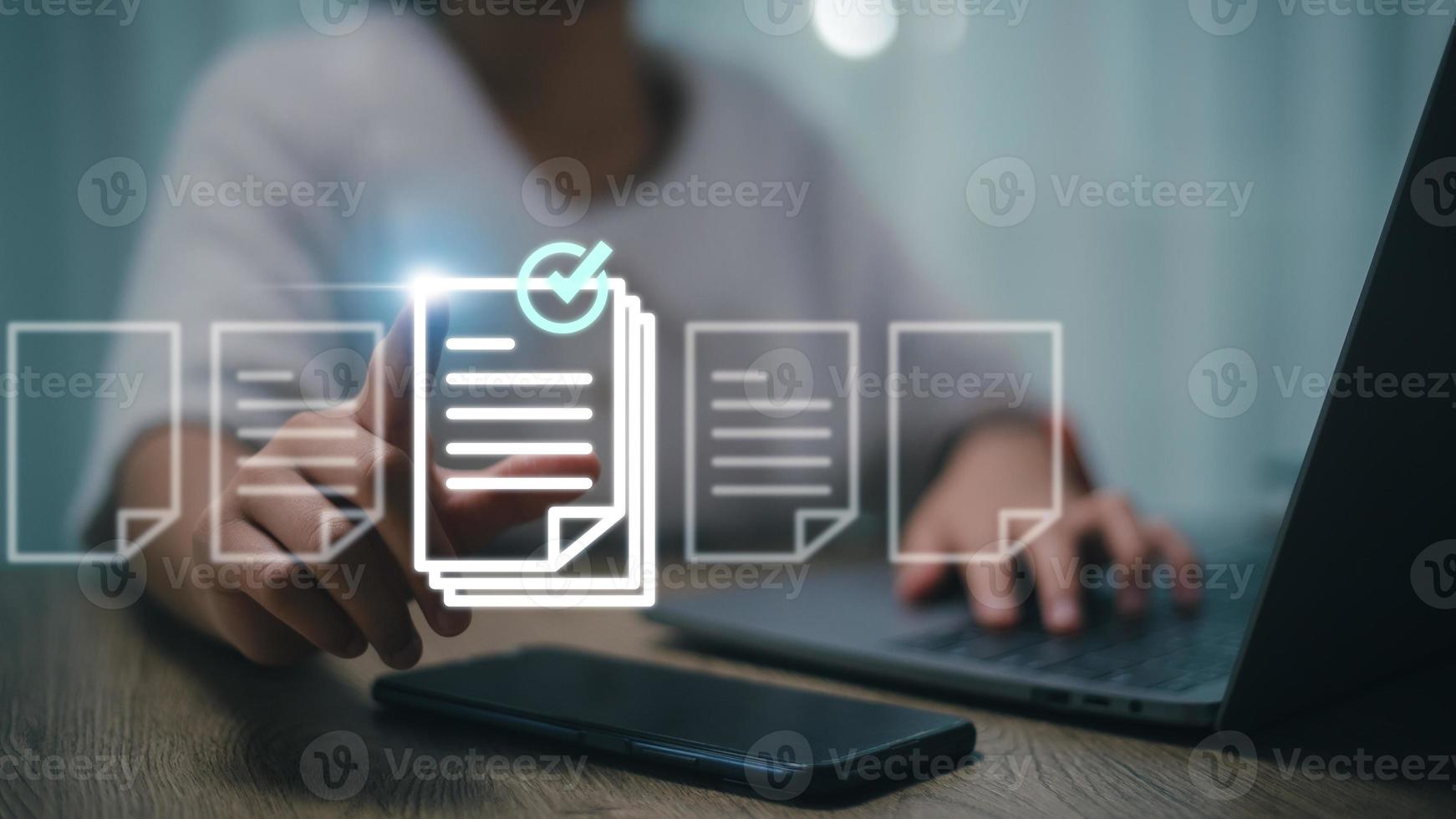 Prepare check and approve concepts. Document management, paperless. Women touching on virtual screen to tick mark documents for online approve paperless quality assurance and ERP management. photo