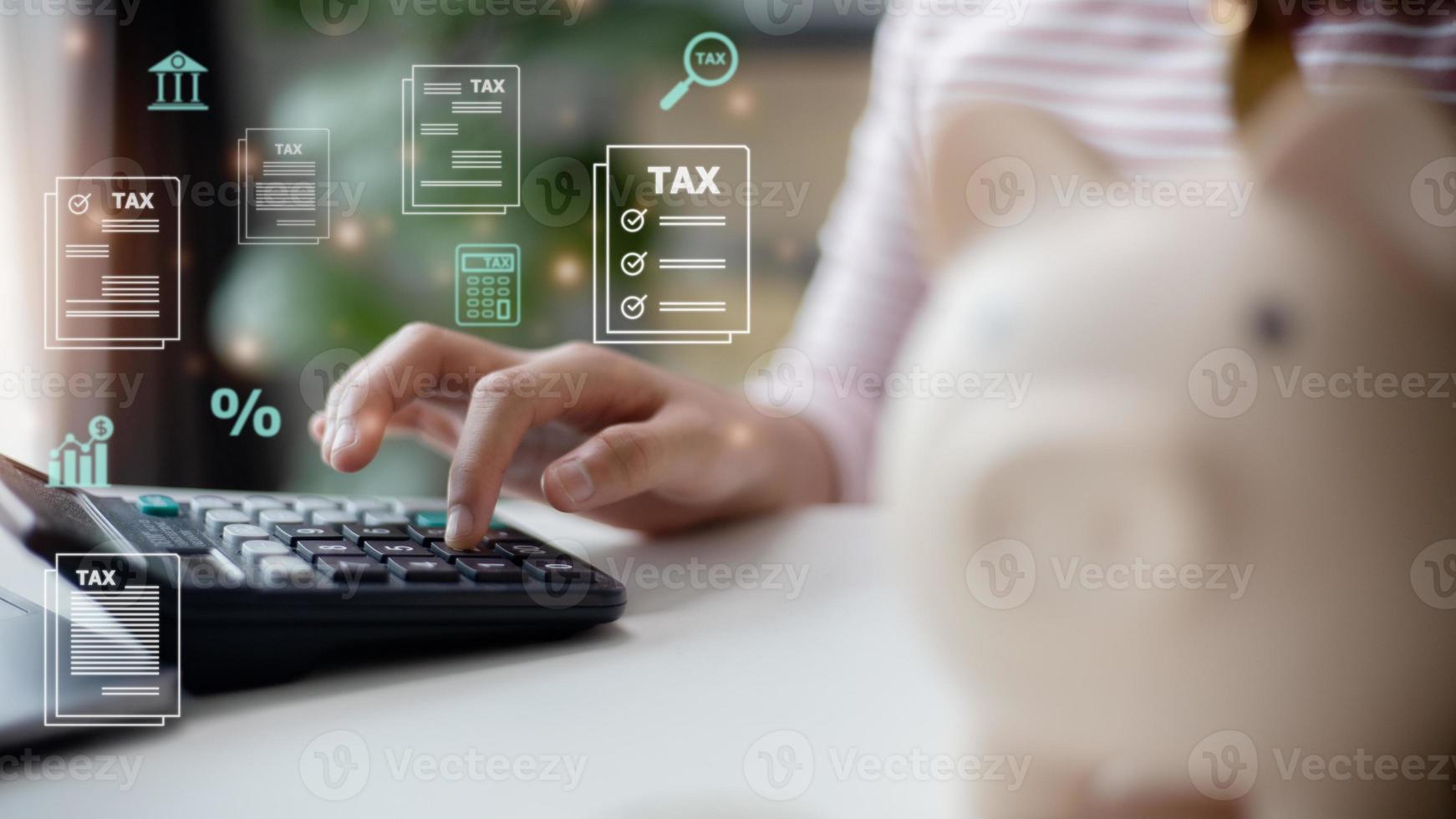 Corporate and individual tax payment concept, woman using computer filling out corporate and personal income tax return, VAT and property tax of business. photo