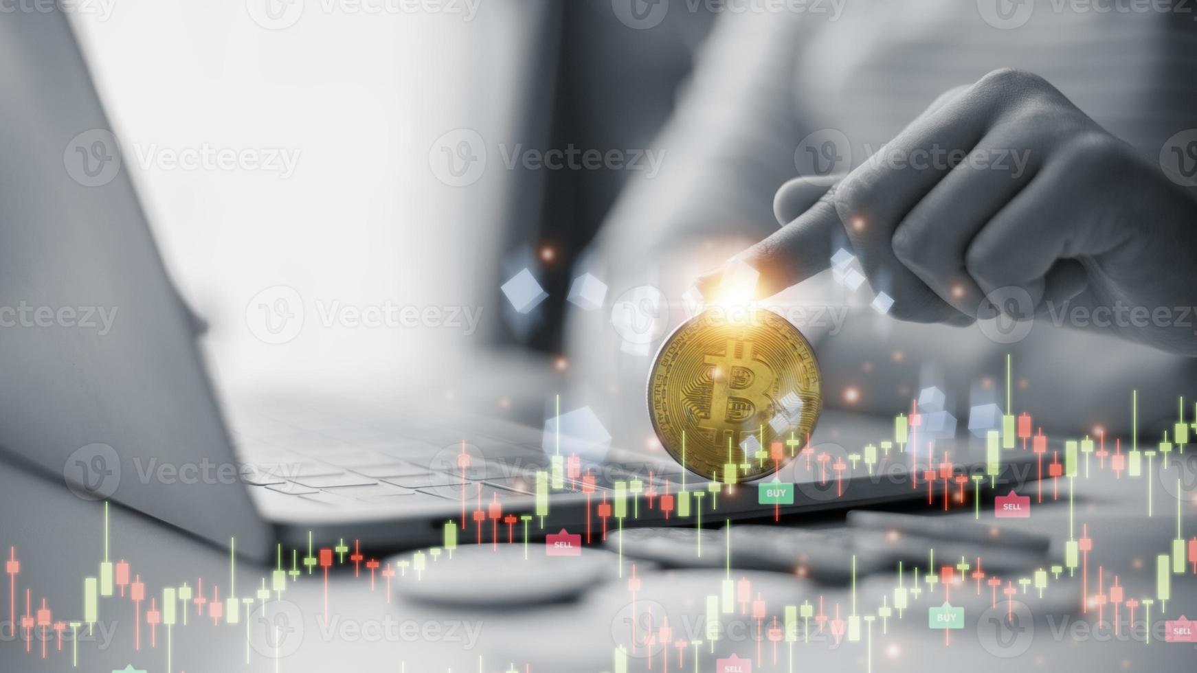 Bitcoin gold coin and defocused chart background. Virtual cryptocurrency concept. photo
