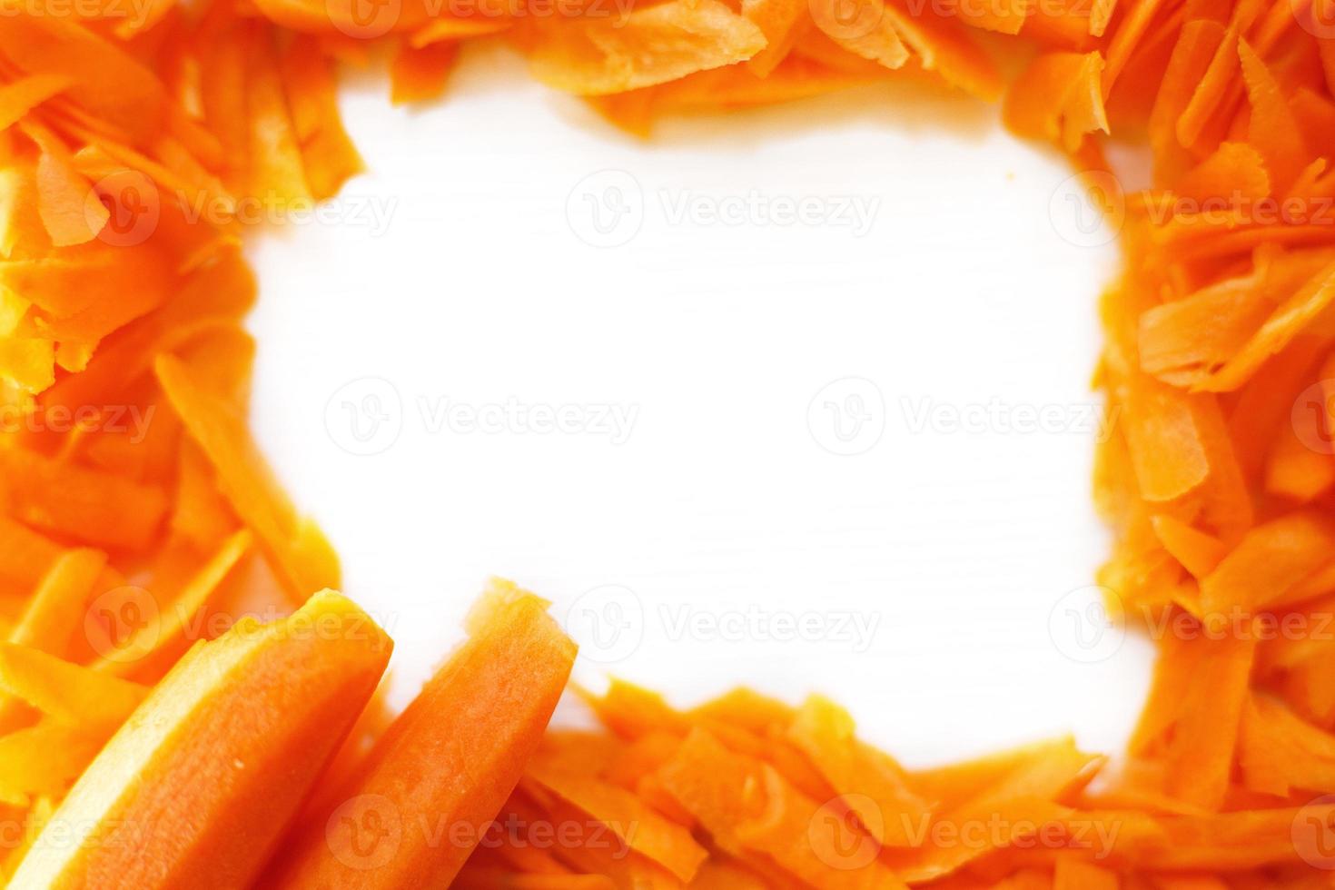 chopped carrots on a white background. fame of a raw carrots photo