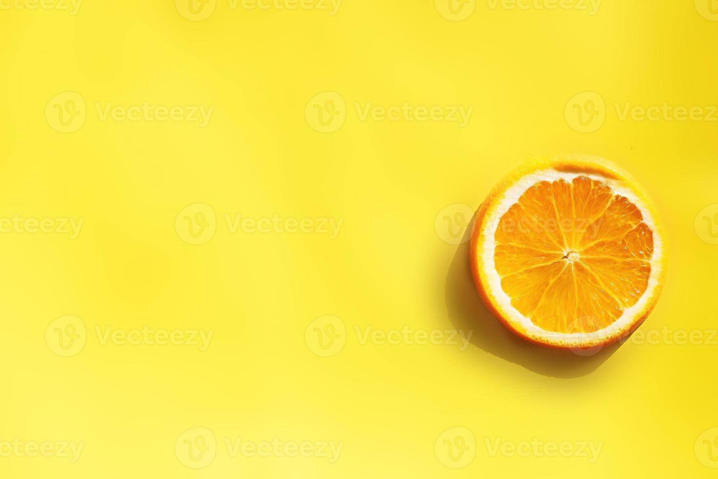 circle of orange on yellow background photo