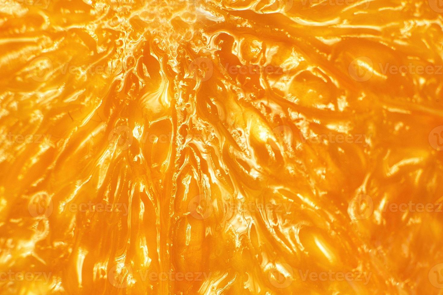 orange slice macro. juicy orange sliced closeup photo