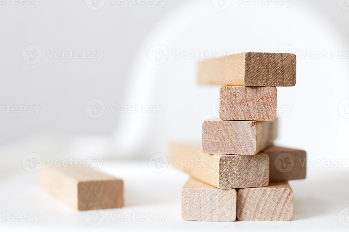 wooden pyramid on the highchair. stick game. photo