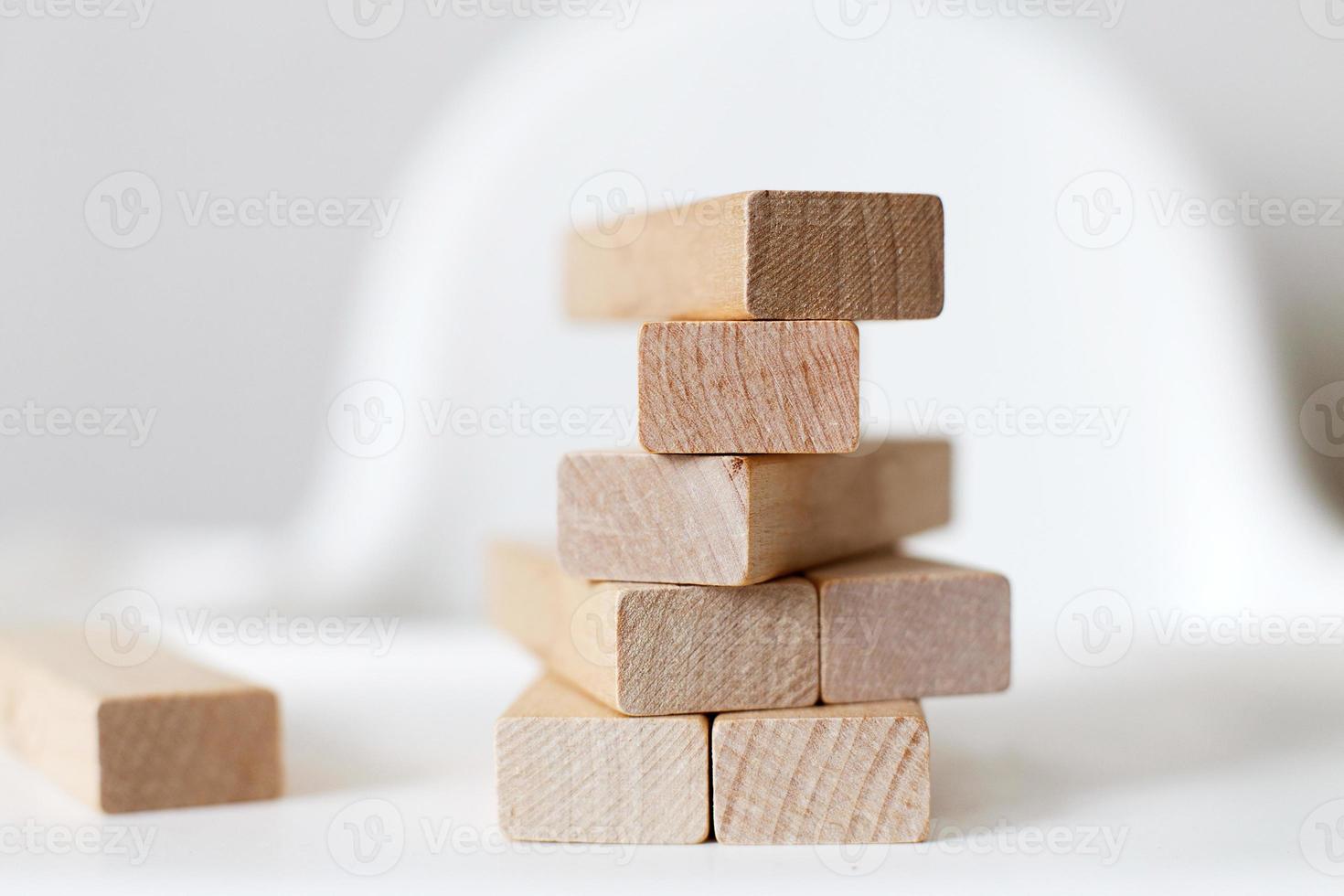 wooden pyramid on the highchair.  stick game. photo