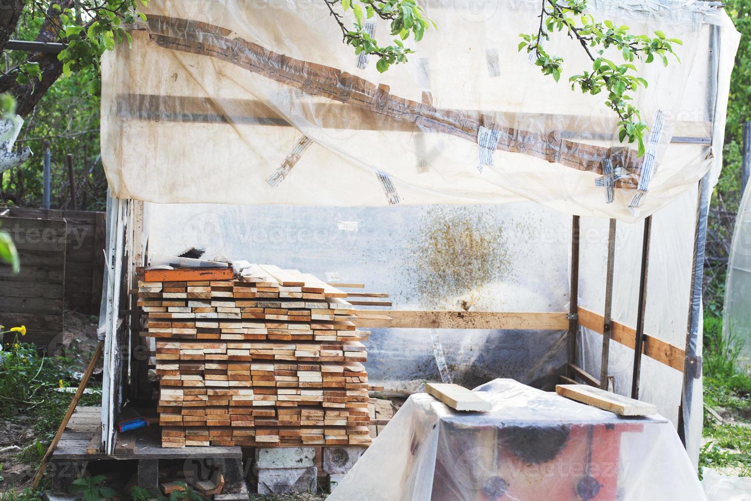 the boards are stacked in the garden photo