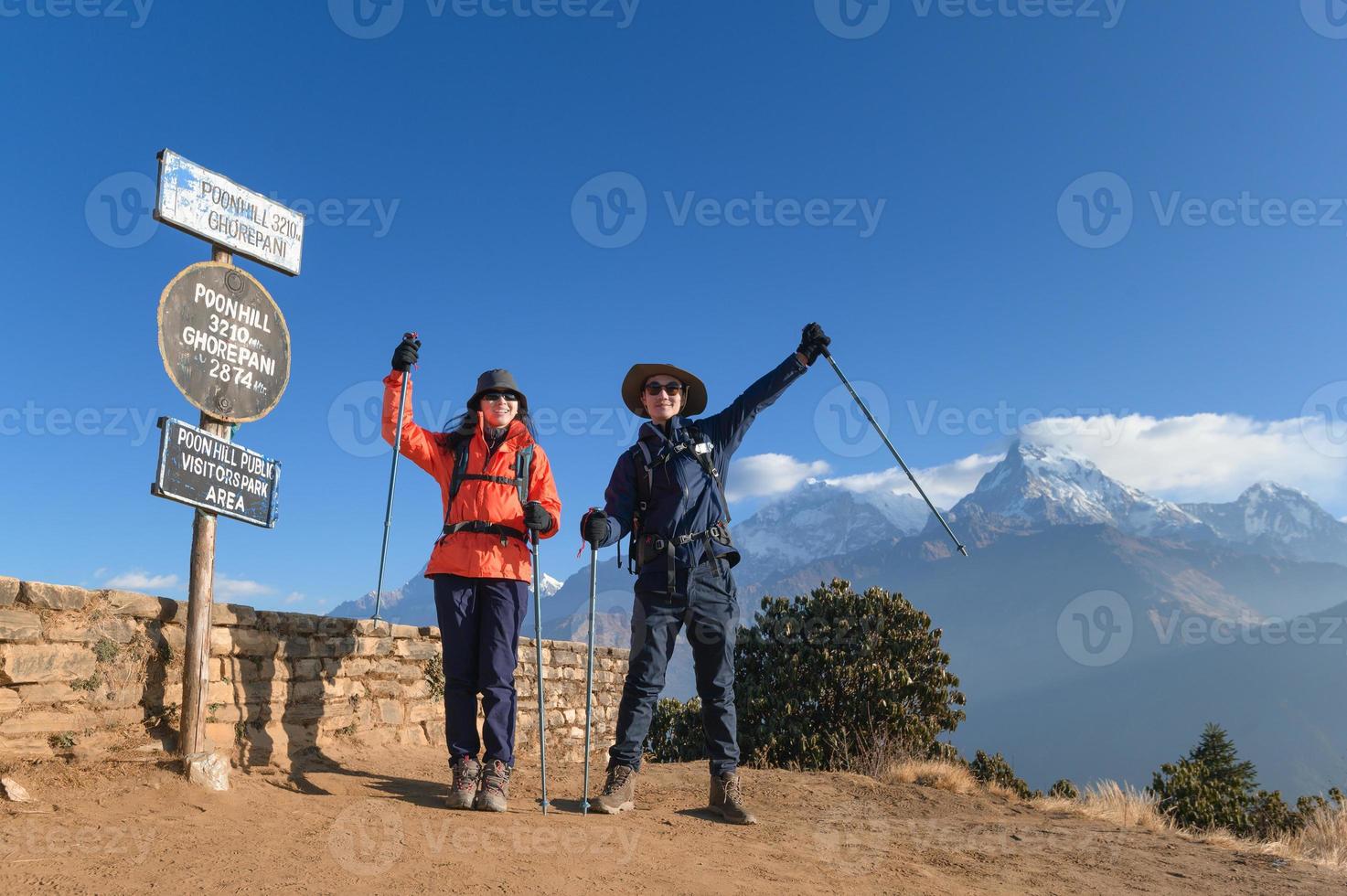 A young traveller trekking in Poon Hill view point in Ghorepani, Nepal photo