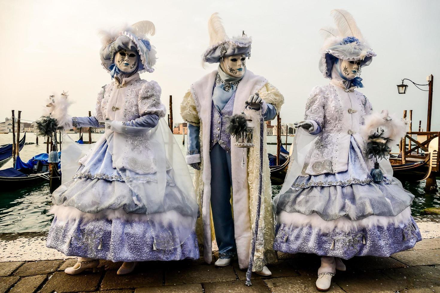 Unidentified people wearing carnival masks at the Venice Carnival in Venice, Italy, circa February 2022 photo