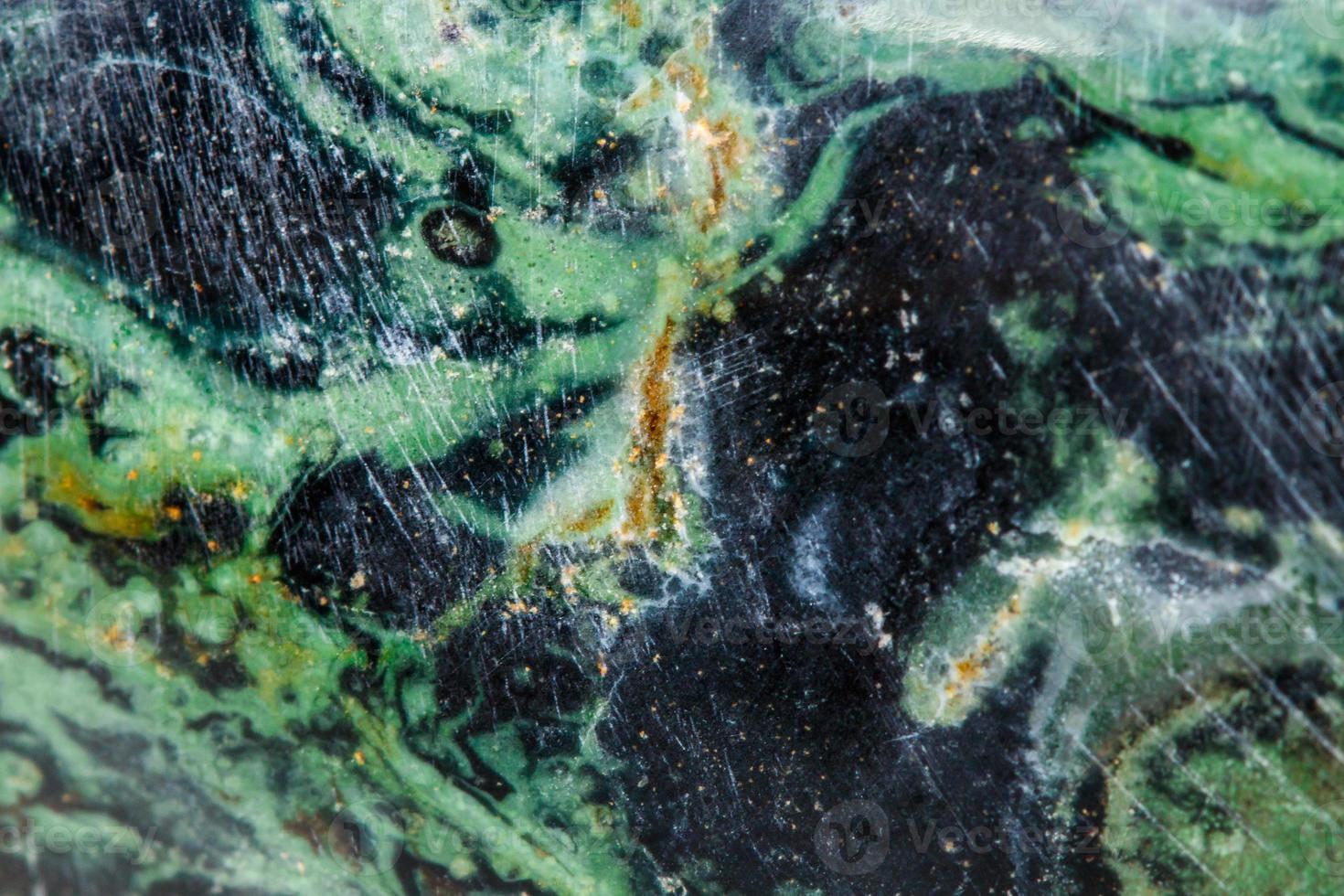 Macro mineral stone jasper kambaba on a white background photo