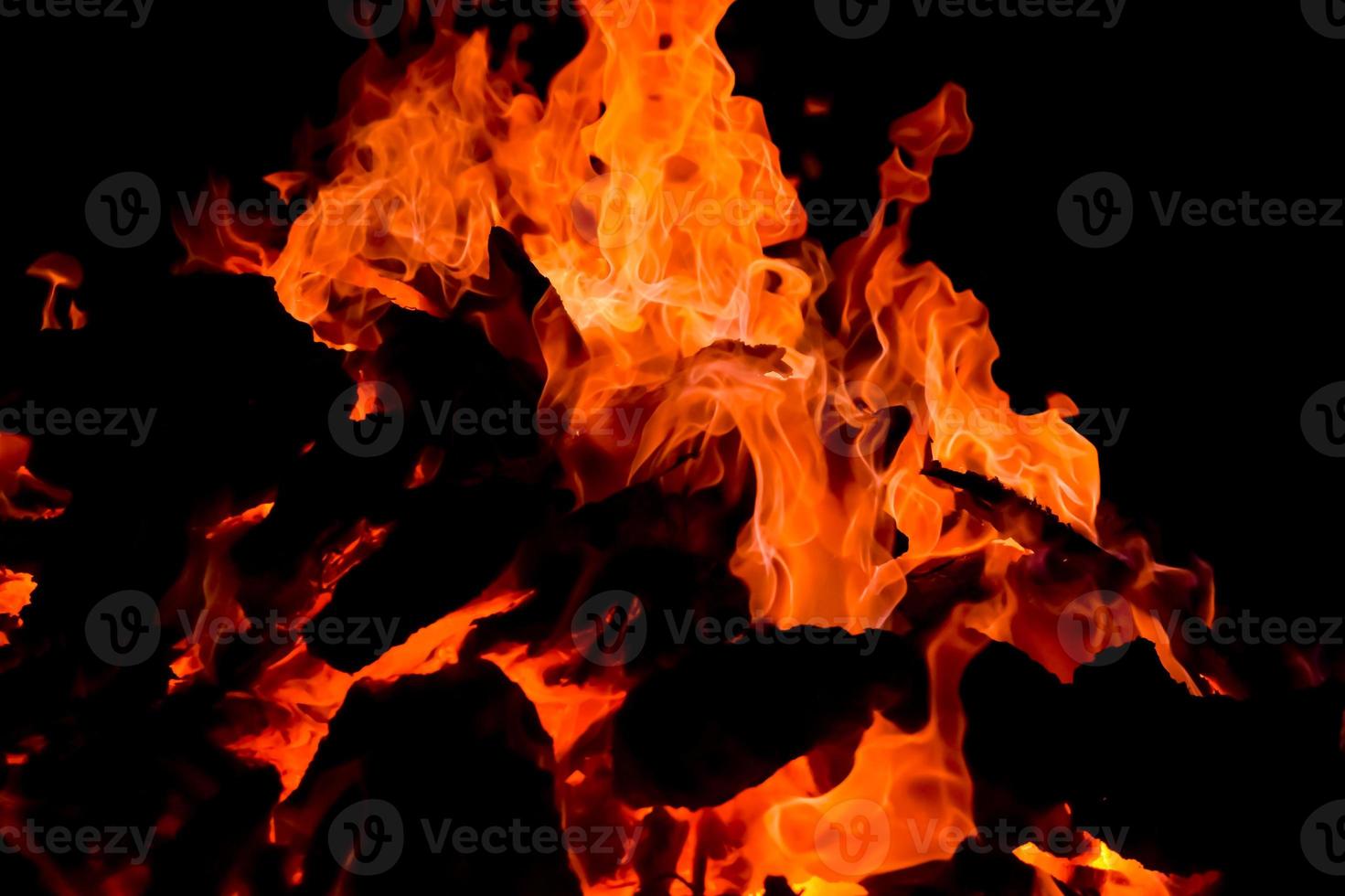 Fire flames on black background, Blaze fire flame texture background, Beautifully, the fire is burning, Fire flames with wood and cow dung bonfire photo