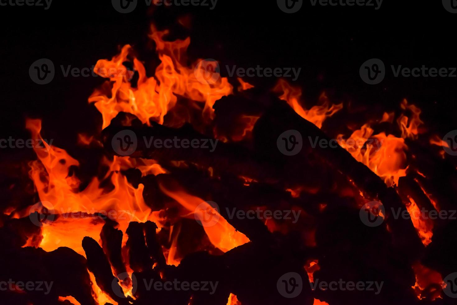 Fire flames on black background, Blaze fire flame texture background, Beautifully, the fire is burning, Fire flames with wood and cow dung bonfire photo