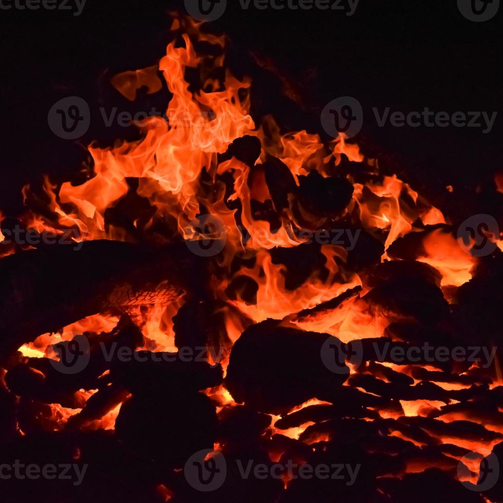Fire flames on black background, Blaze fire flame texture background, Beautifully, the fire is burning, Fire flames with wood and cow dung bonfire photo