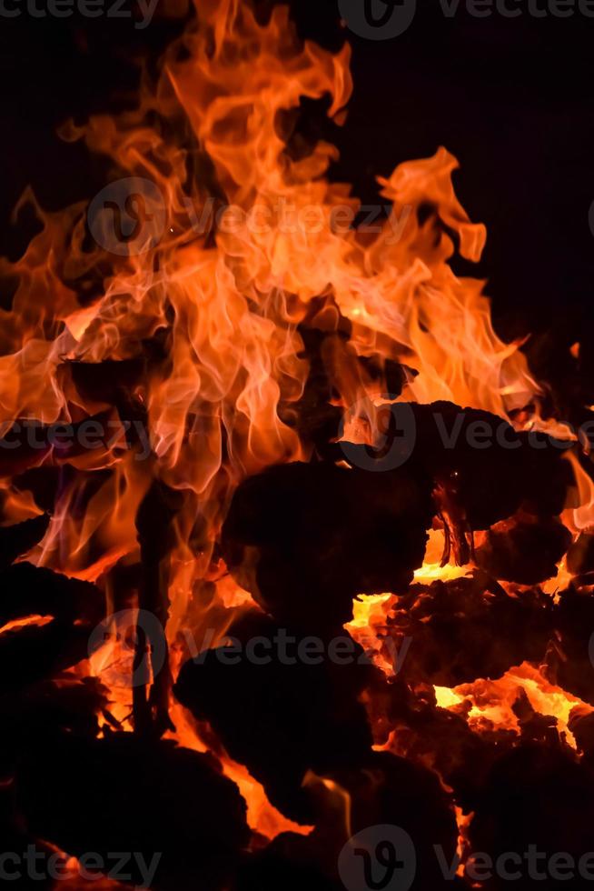 Fire flames on black background, Blaze fire flame texture background, Beautifully, the fire is burning, Fire flames with wood and cow dung bonfire photo