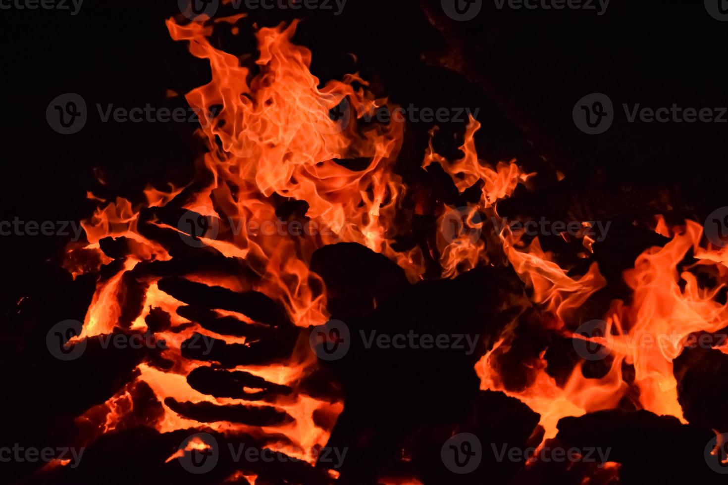Fire flames on black background, Blaze fire flame texture background, Beautifully, the fire is burning, Fire flames with wood and cow dung bonfire photo