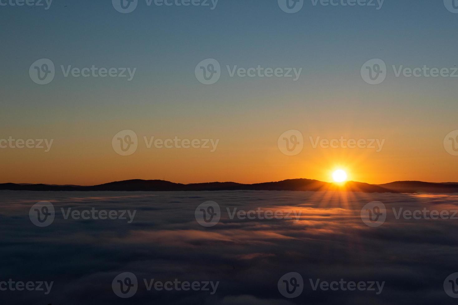 sunrise above the clouds photo