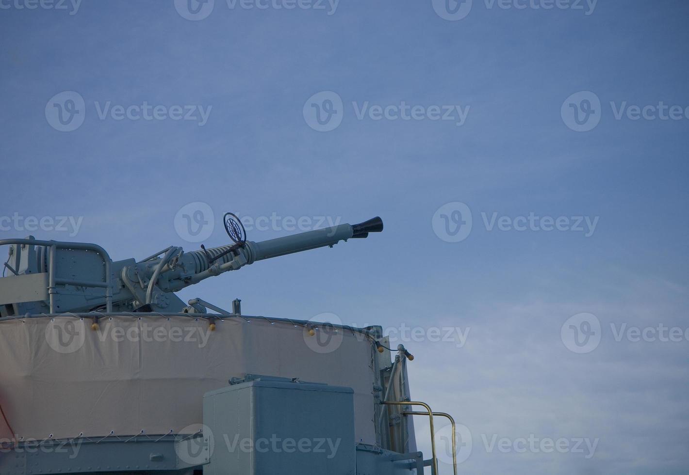 anti-aircraft gun on a warship against the sky photo