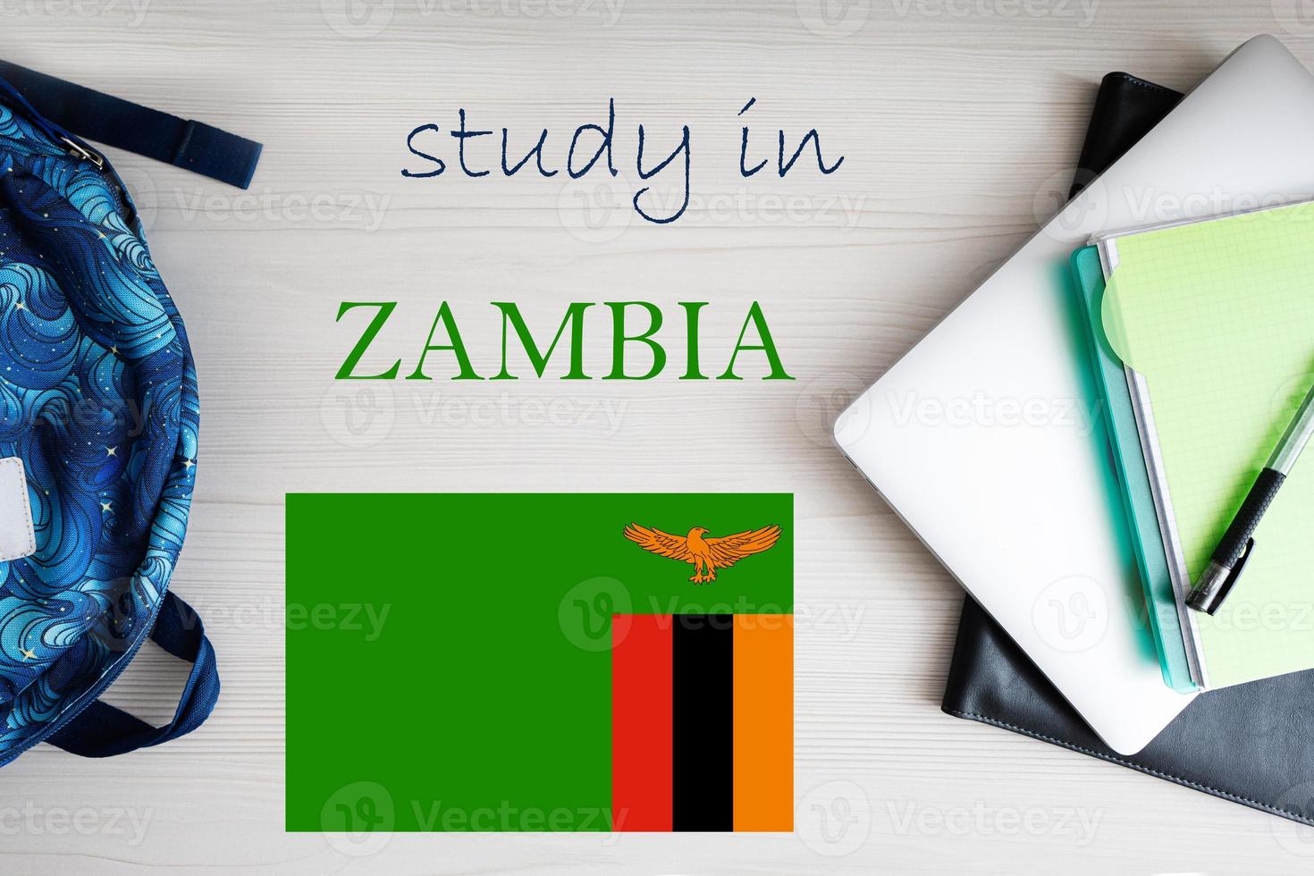 Study in Zambia. Background with notepad, laptop and backpack. Education concept. photo