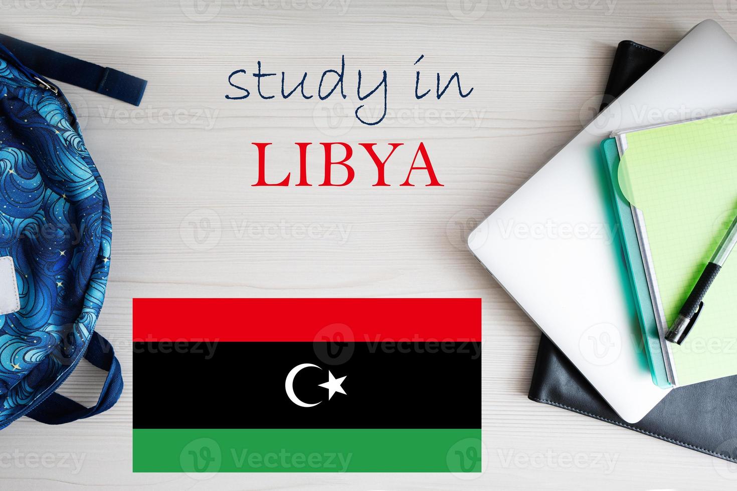 Study in Libya. Background with notepad, laptop and backpack. Education concept. photo