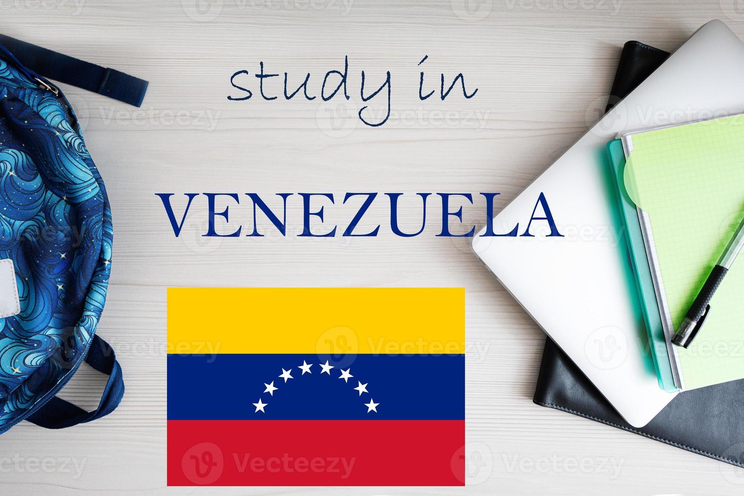 Study in Venezuela. Background with notepad, laptop and backpack. Education concept. photo