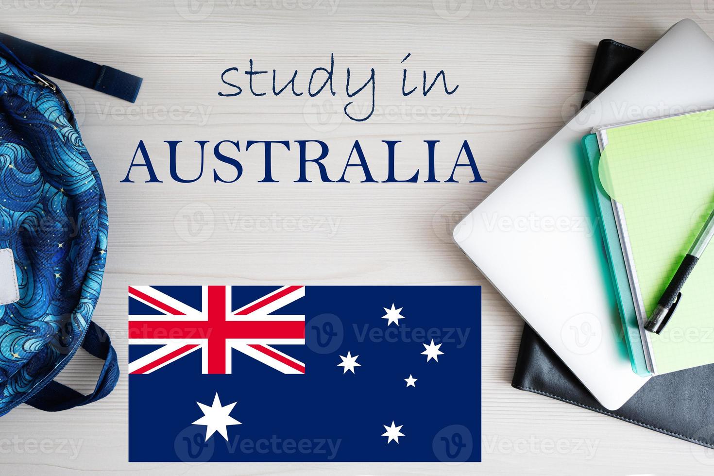 Study in Australia. Background with notepad, laptop and backpack. Education concept. photo