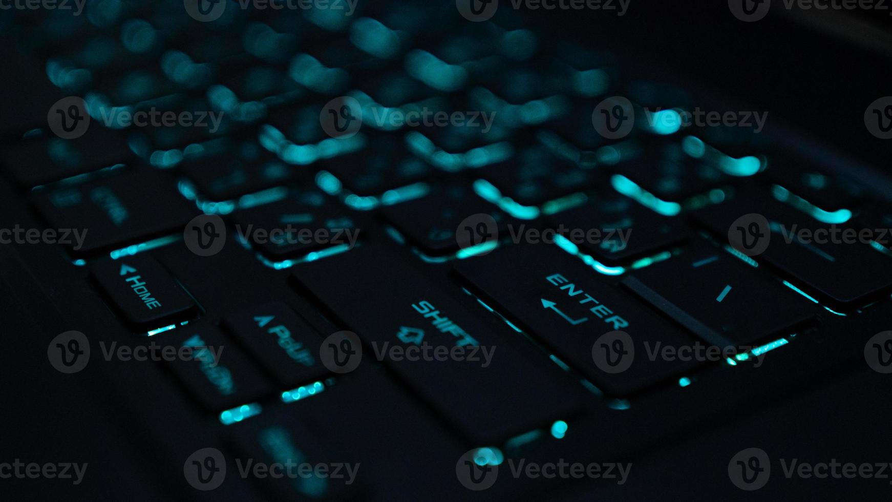 A computer keyboard is an input device that allows a person to enter letters, numbers, and other symbols keyboard with green back-light photo
