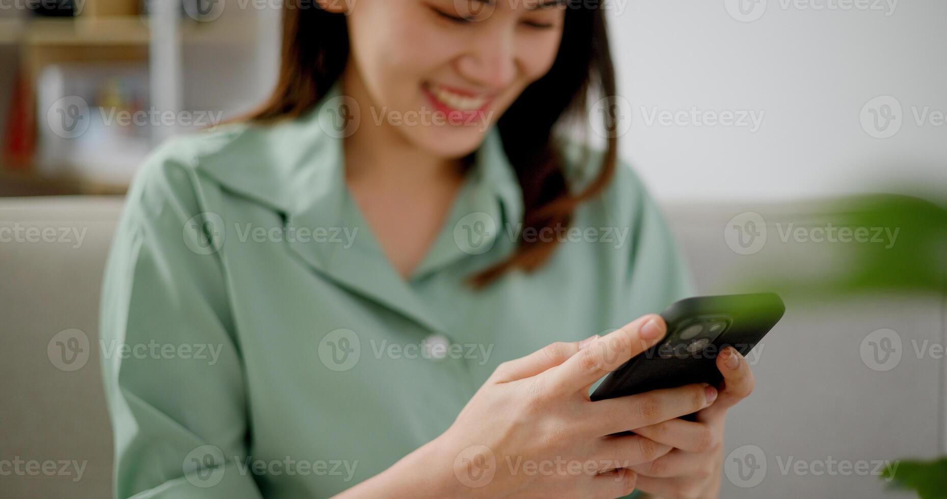 Portrait of Asian young woman using a smartphone photo