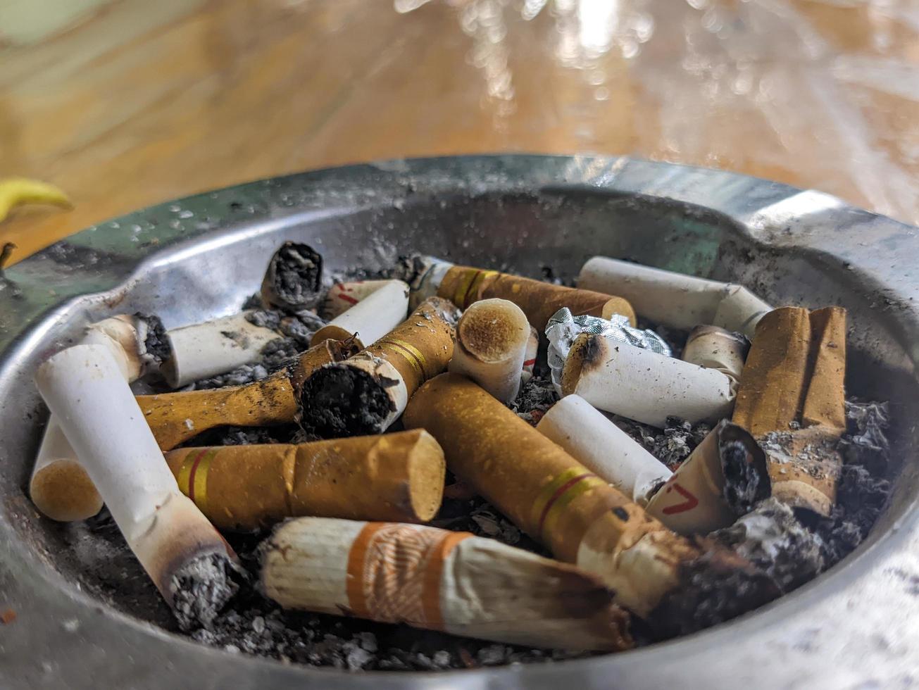 A close up of cigarette butts in the ashtray photo