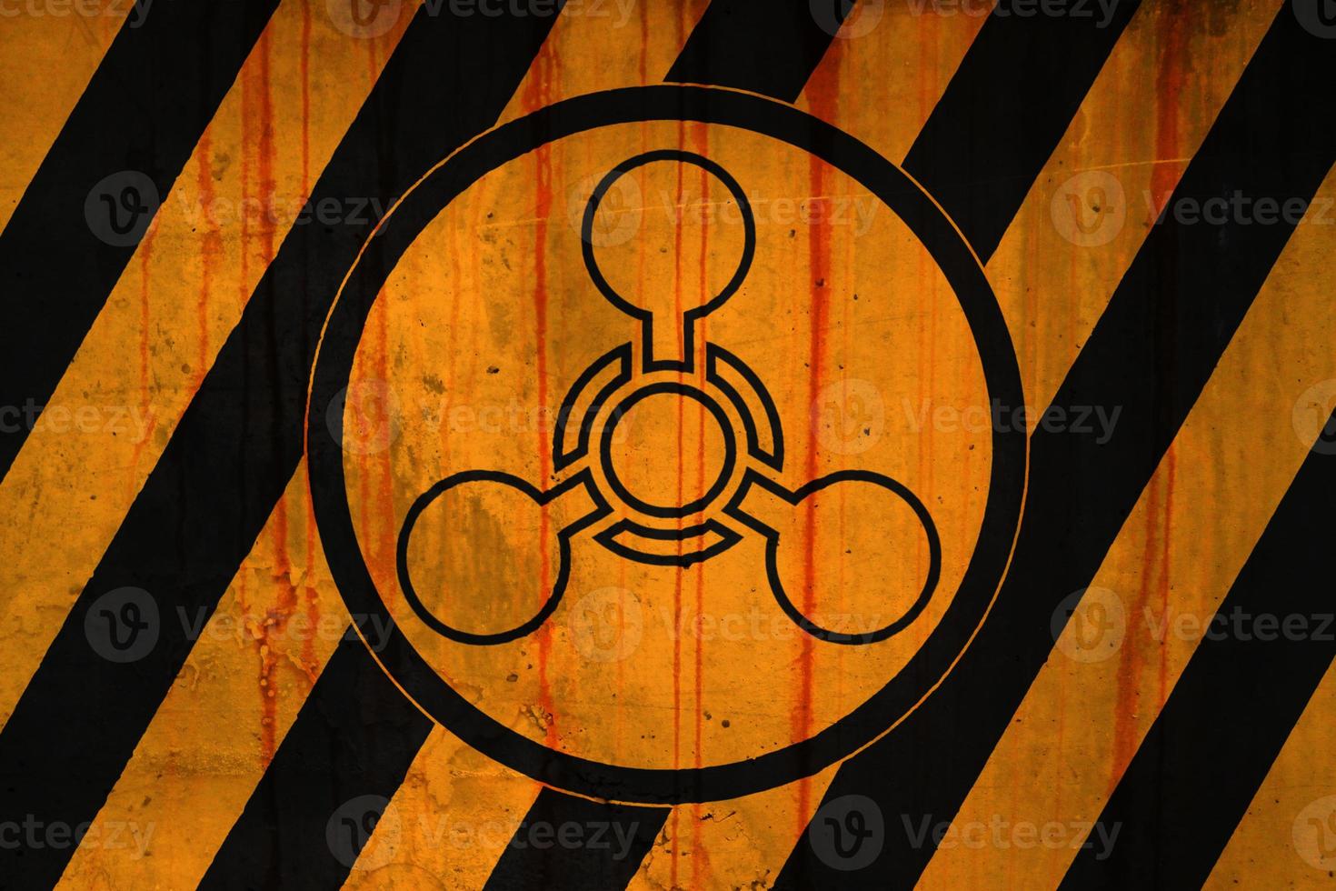 Chemical weapon symbol on a striped painted concrete wall photo