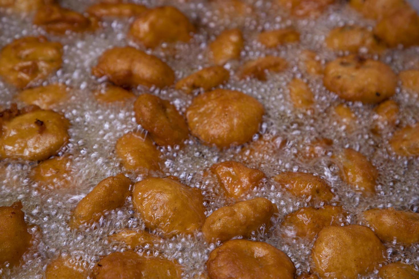 View of Traditional Bangladeshi street food Potato bora , Chop fried on the pan photo