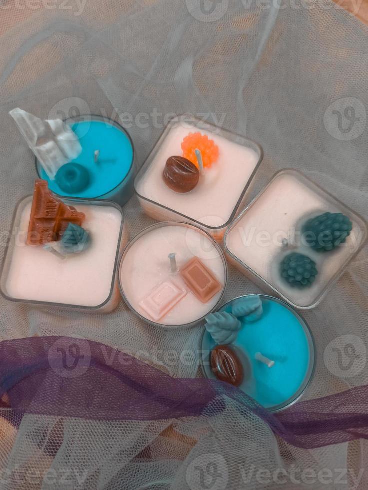 A bunch of dessert tealight candle with different colors photo