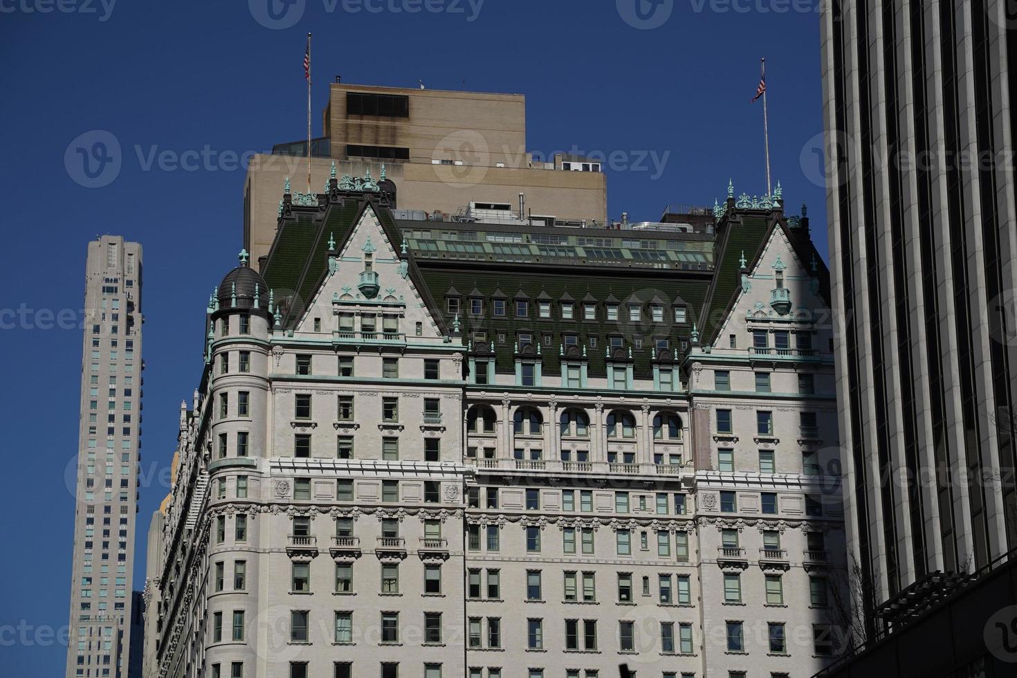 new york manhattan skyscrapers view from the street to the top of the building on sunny clear day photo