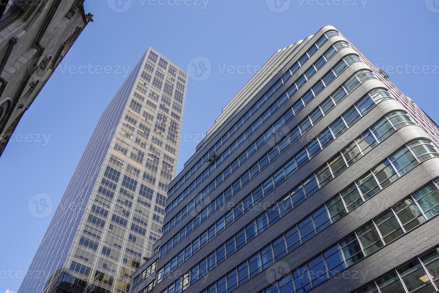 new york manhattan skyscrapers view from the street to the top of the building on sunny clear day photo