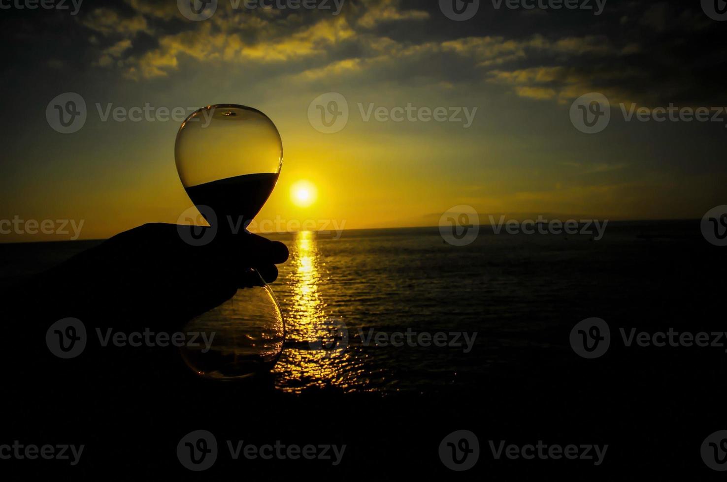 A beautiful sunset view and an hourglass photo