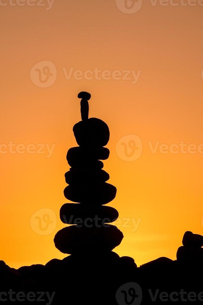 A beautiful sunset view with a stone pyramid photo