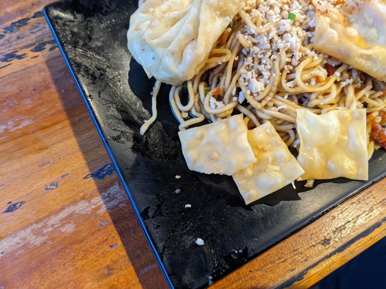 Close up photo of traditional spicy noodle from Indonesia. The photo is suitable to use for traditional food background, poster and food content.