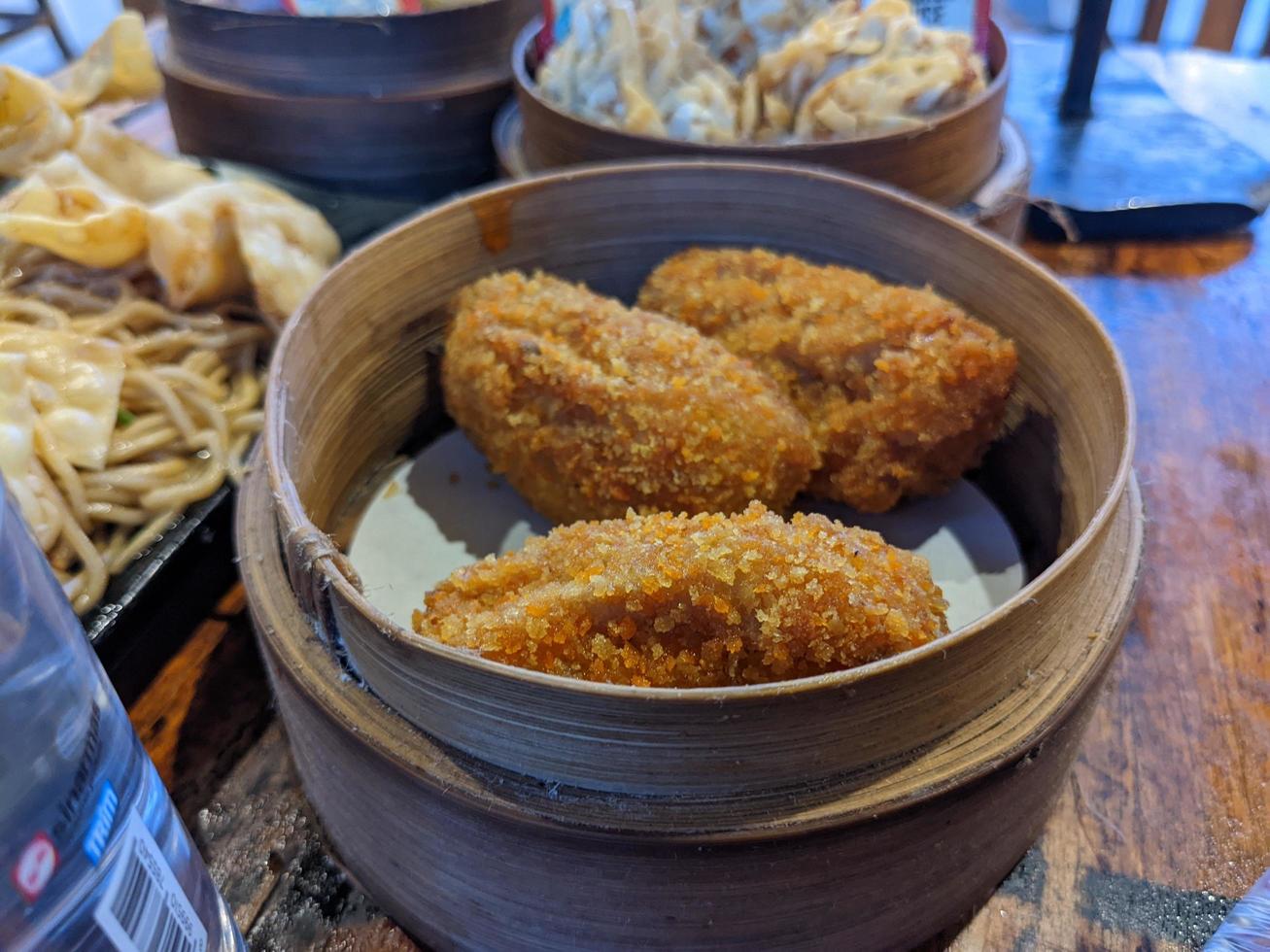 Cheese shrimp on the bamboo bucket and the dimsum traditional food from chinese. The photo is suitable to use for Chinese traditional food background, poster and food content media.