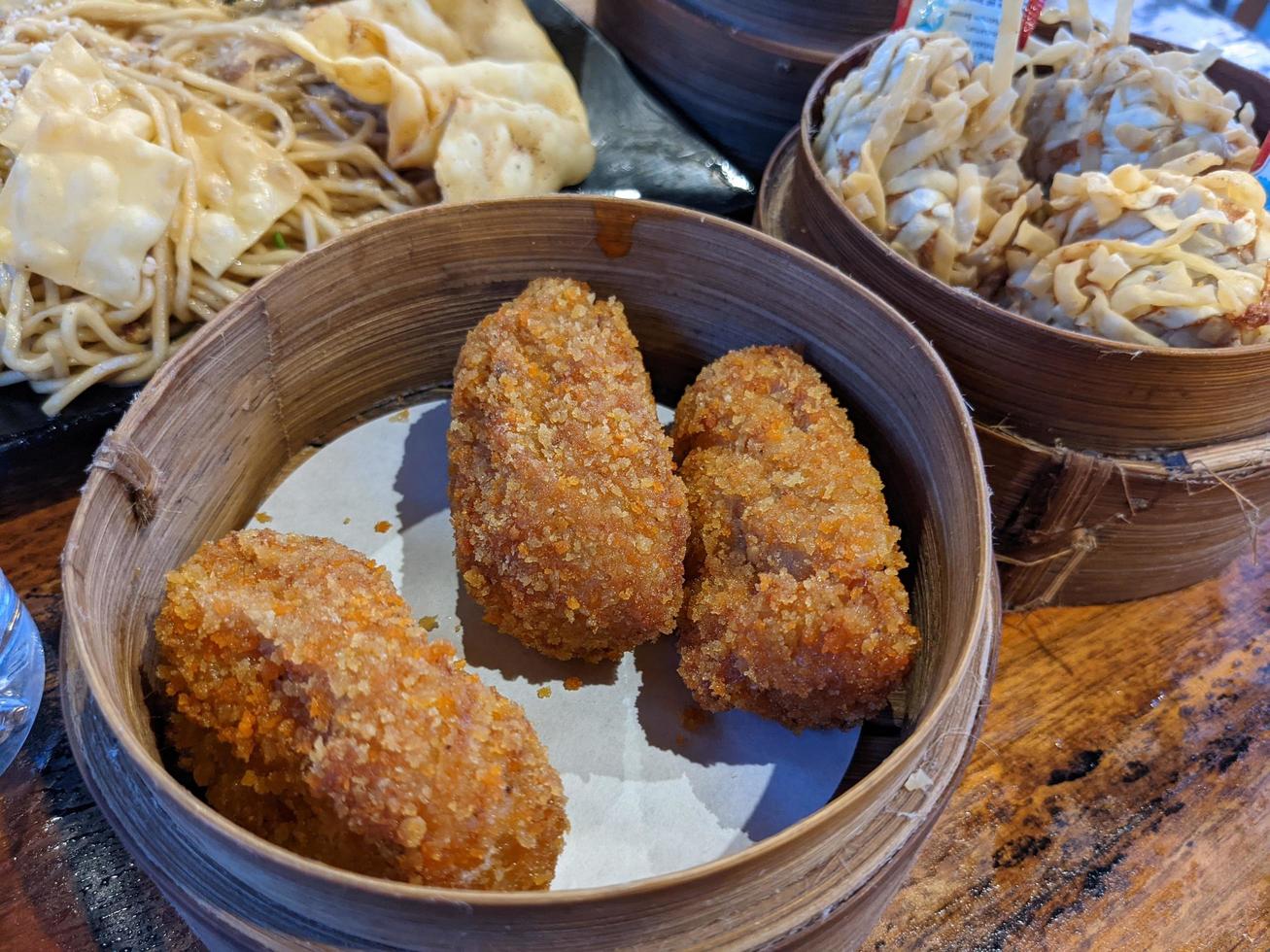 Cheese shrimp on the bamboo bucket and the dimsum traditional food from chinese. The photo is suitable to use for Chinese traditional food background, poster and food content media.