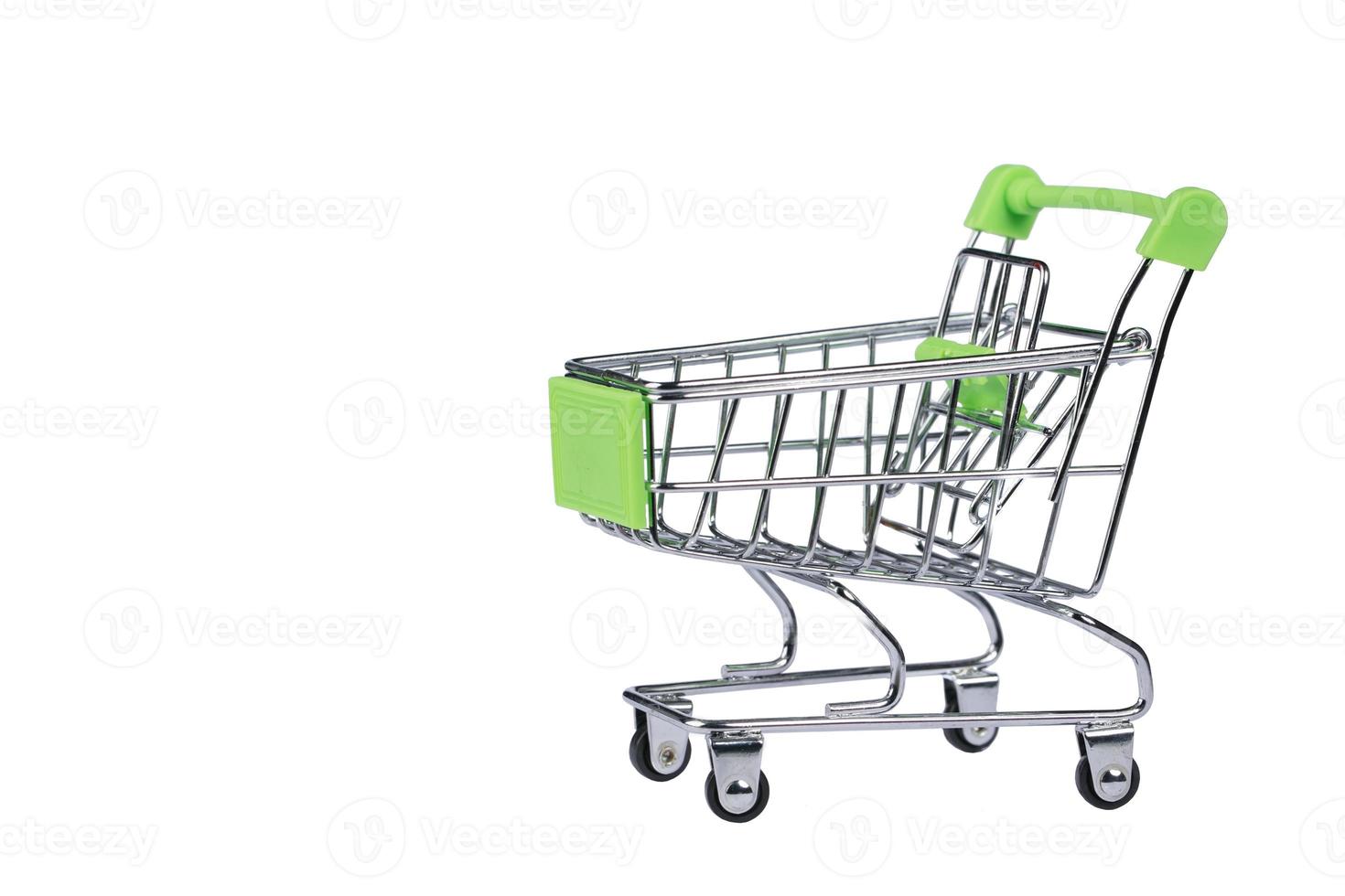 Miniature supermarket trolley on a white background. photo