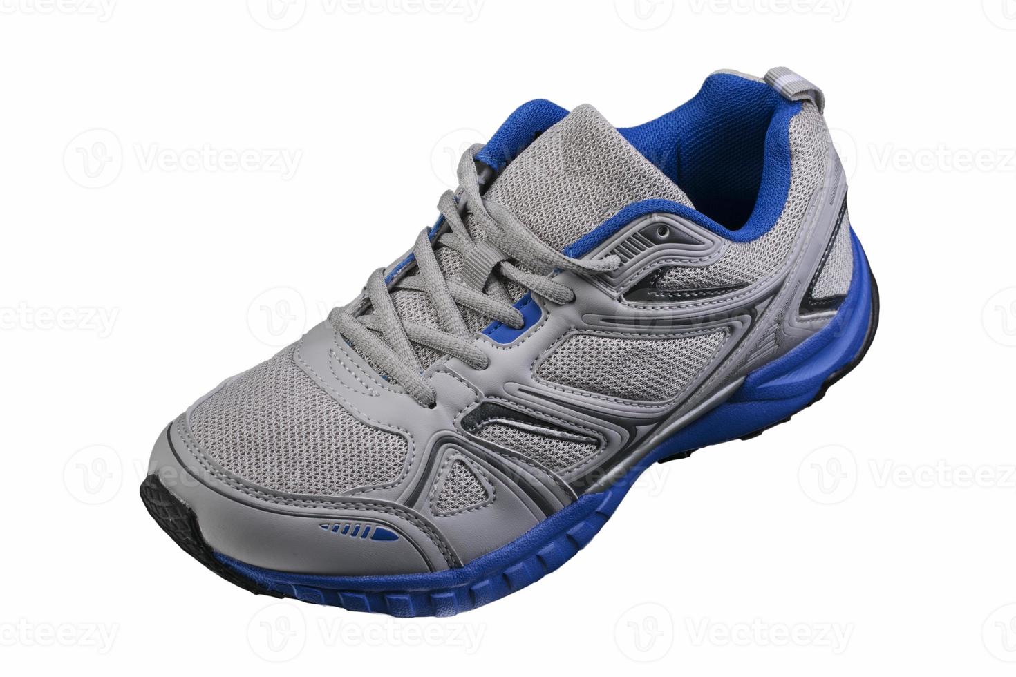Gray sneaker with blue accents isolated. Sports shoes on a white background. photo