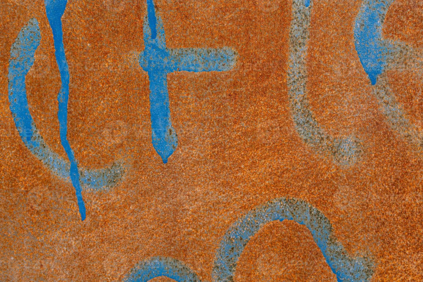 rusty background with blue elements in close-up photo