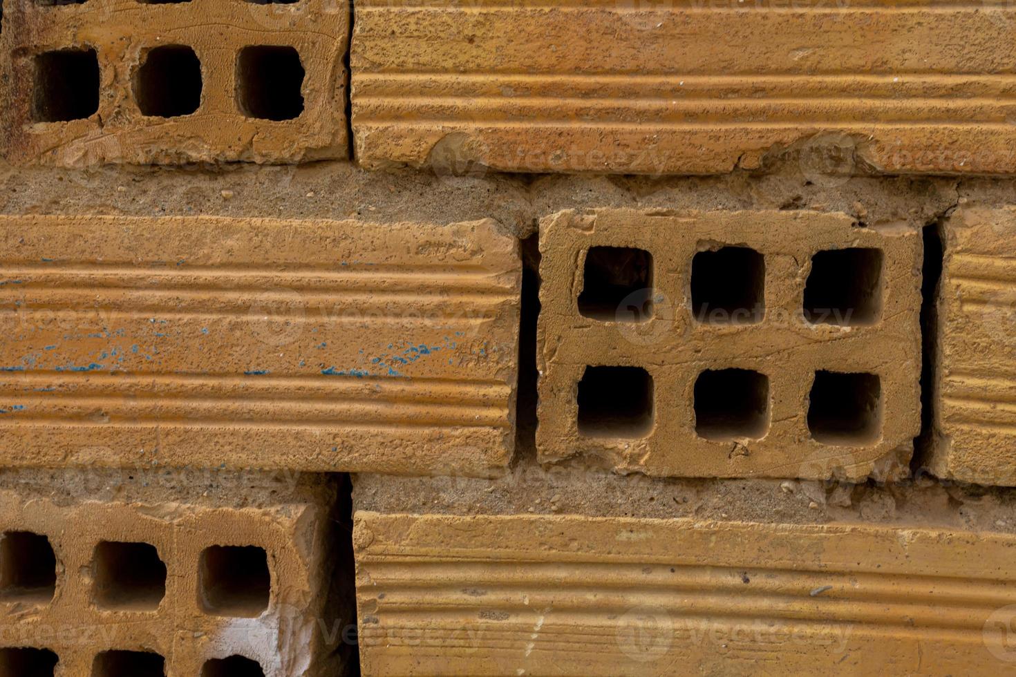 original abstract background from clay brown bricks in closeup photo