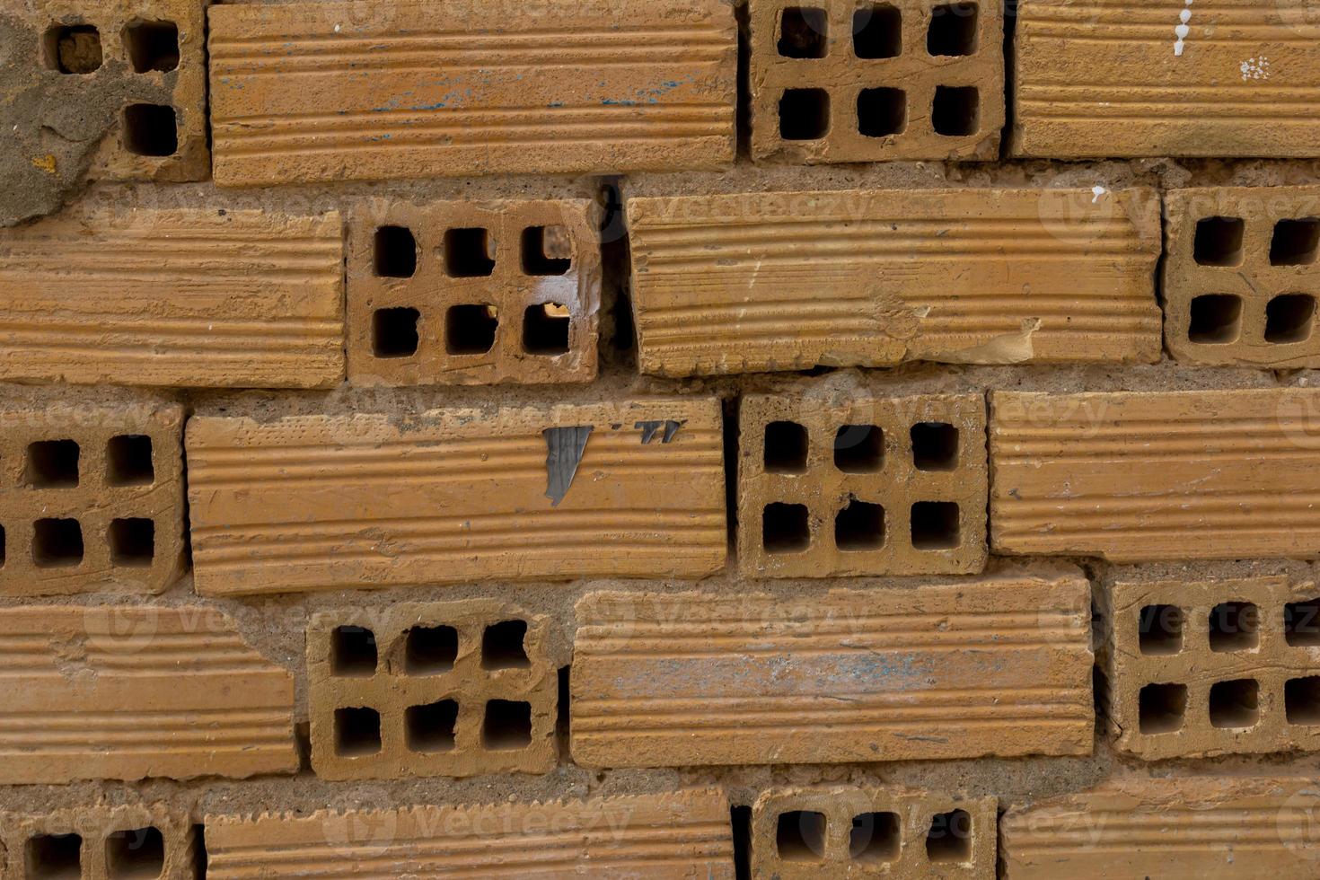 original abstract background from clay brown bricks in closeup photo