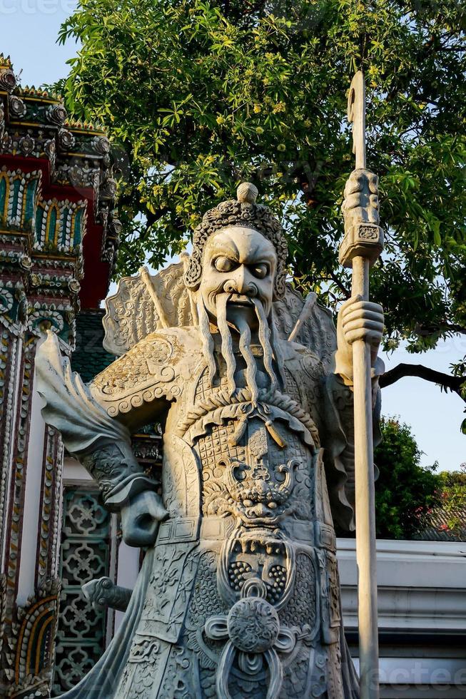 Old oriental statue photo