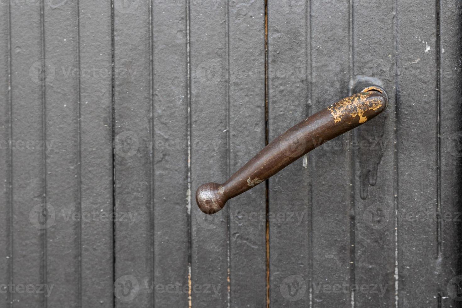 door handle on a background of a gray gate as a background photo