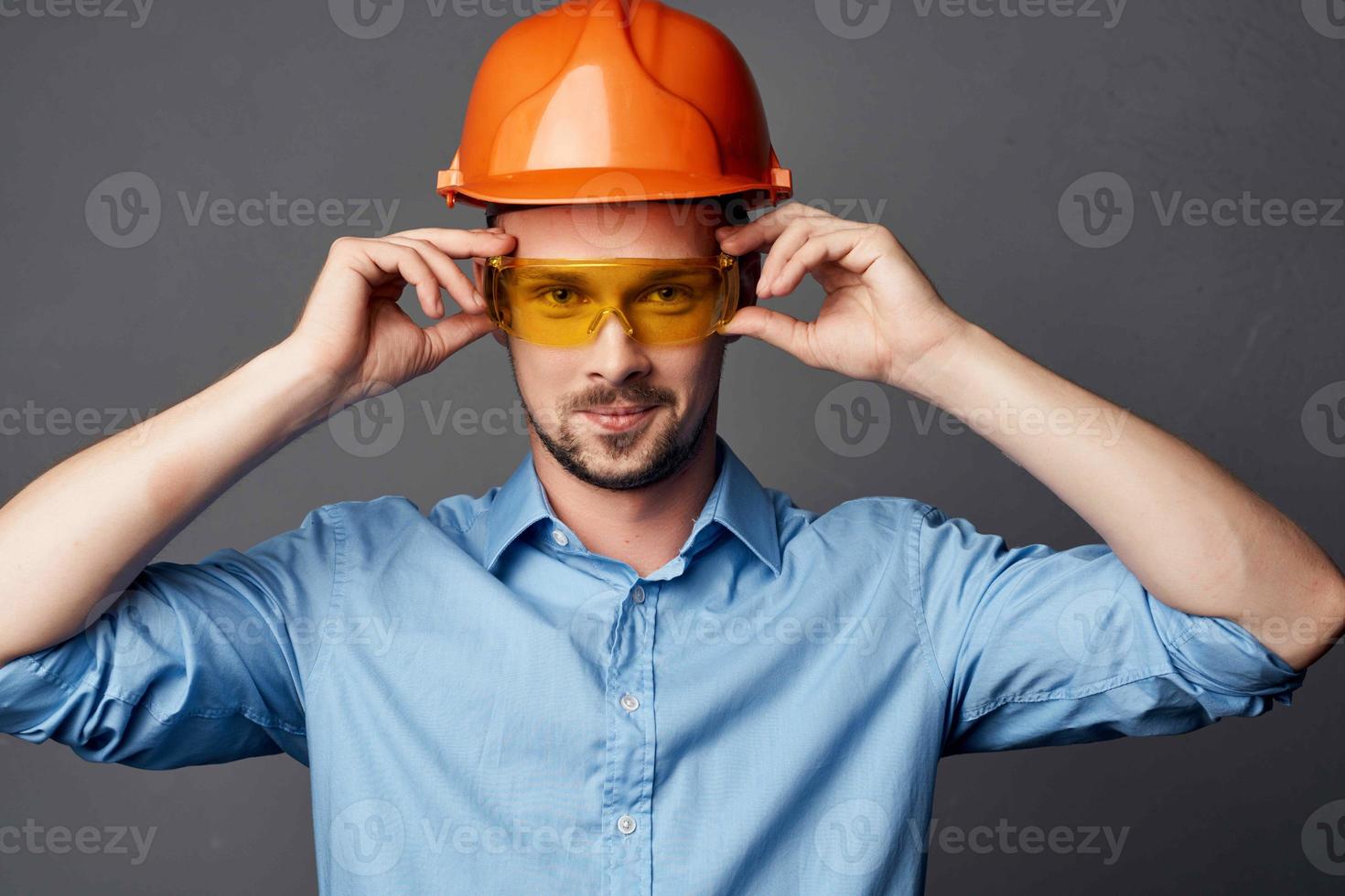 man in construction uniform blue shirt gesture hands emotions work photo